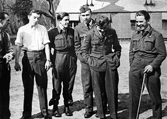 Ladislav KADLEC shows to his comrades, how is possible to walk with false leg. Zdenek Hurt collection. 