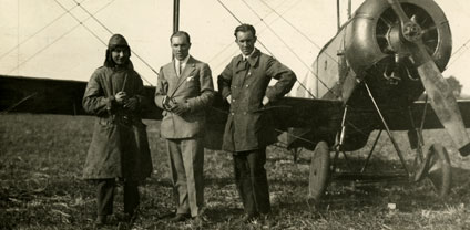 (From left to right) Alan Cobham, Jack Holmes and Fred Holmes standing in front of their Avro 504K biplane while in the Berkshire Aviation Company in 1919.