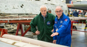 The Sir Michael Beetham Conservation Centre with a volunteer talking to a member of the public