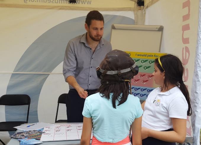 A couple of young visitors talking to a member of the Museum Team.