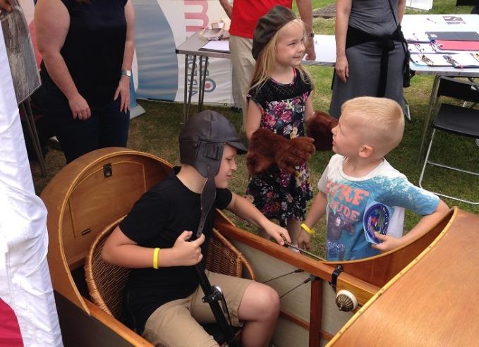 Young visitors handling objects