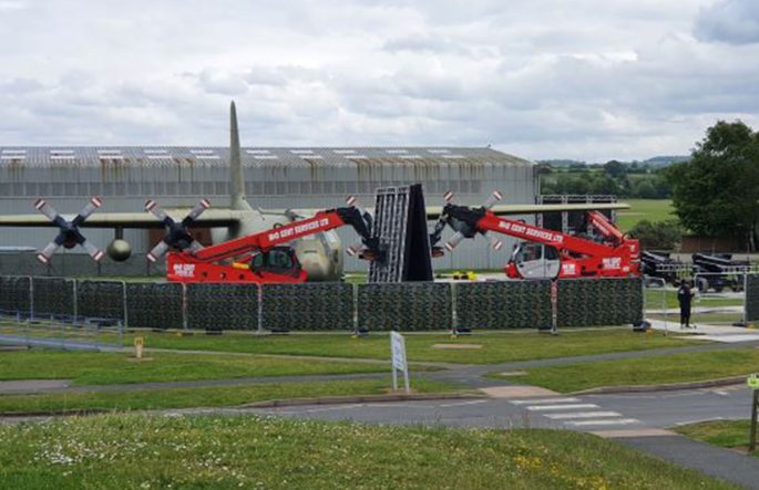 Cranes setting up for an event in the RAF Midlands in front of the Hercules