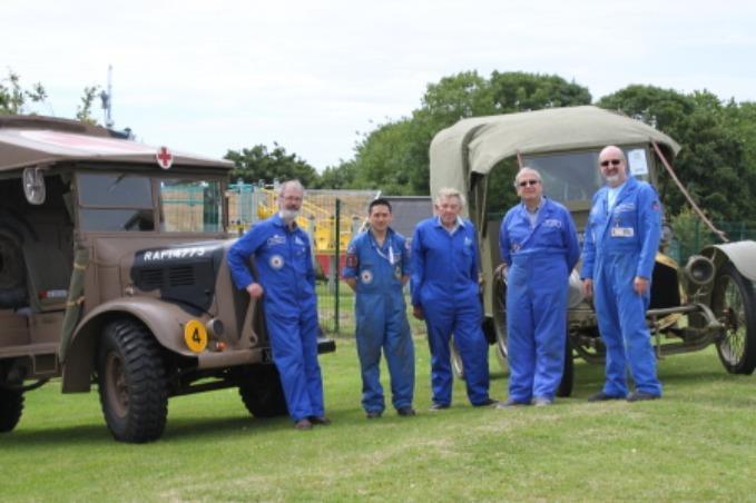 Volunteers team with historical vehicles
