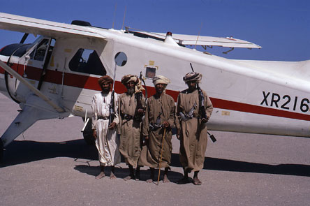 Local tribesmen guarding a De Havilland DHC-2 Beaver of the Sultan of Oman's Air Force
