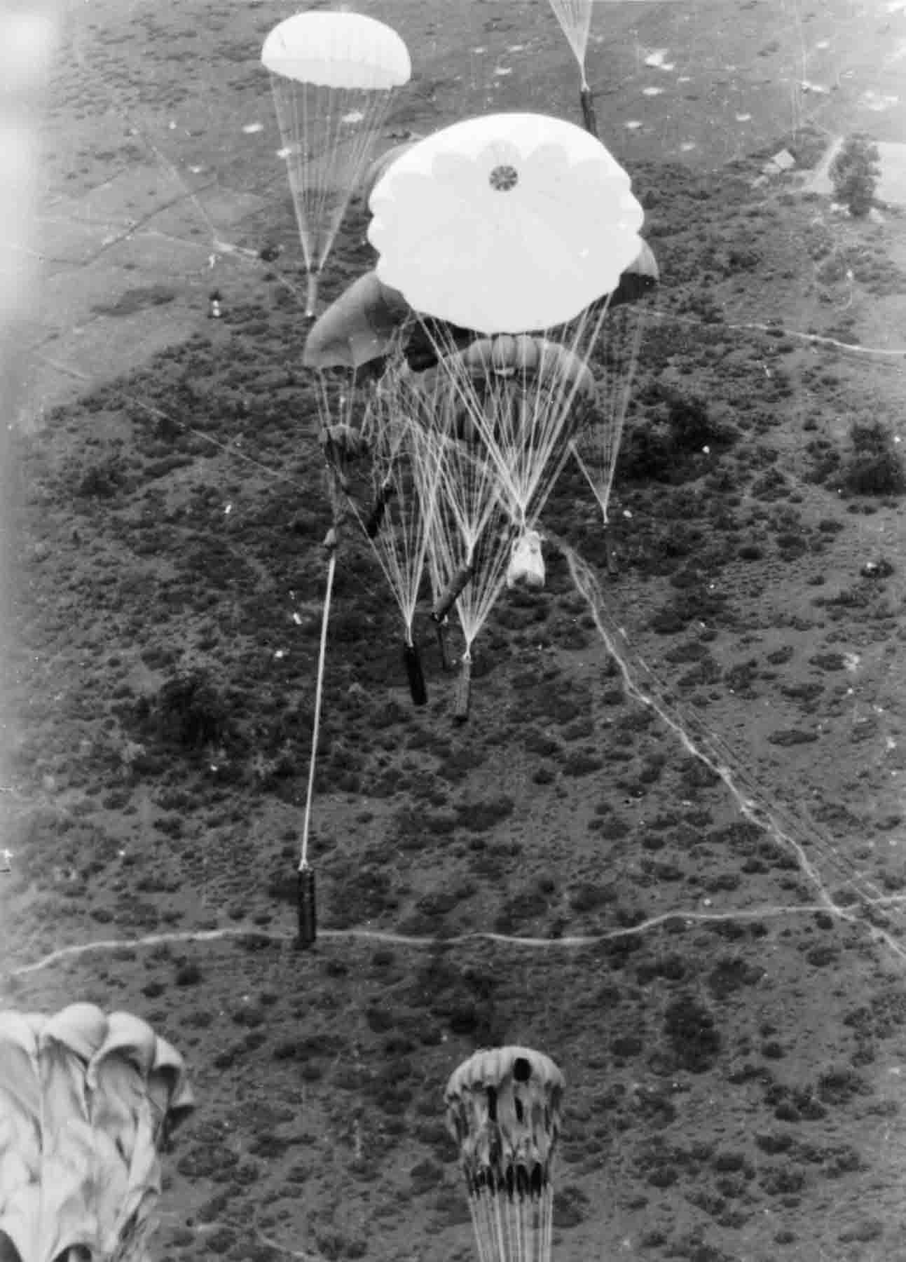 PC71_19_1886 Supply containers going down in Indo-China, 1945