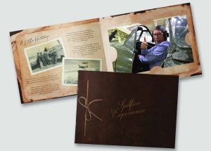 Promotional booklet for the Spitfire Experience showing vintage wartime photos, historical text, and a man giving a thumbs-up while seated in a Spitfire cockpit.