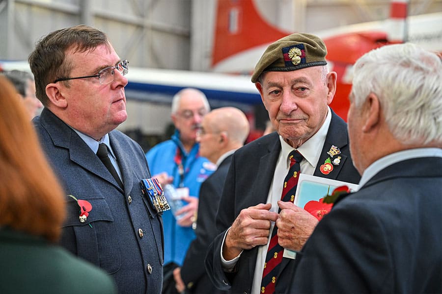 Veterans and RAF personnel talking