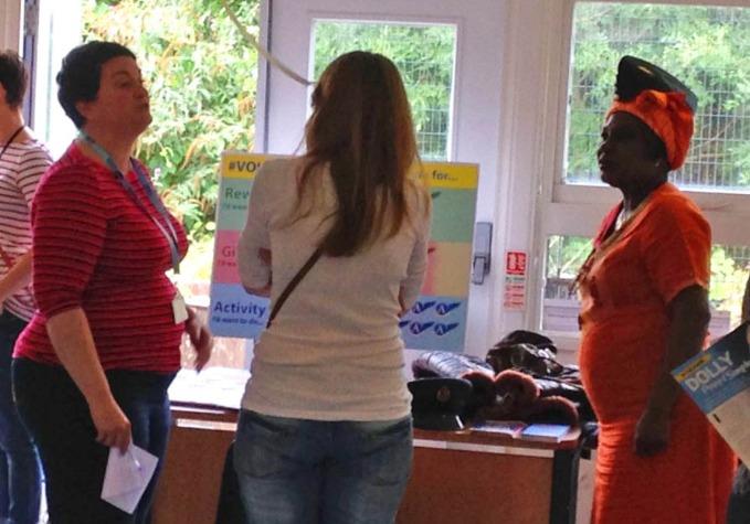 Volunteers talking to visitors